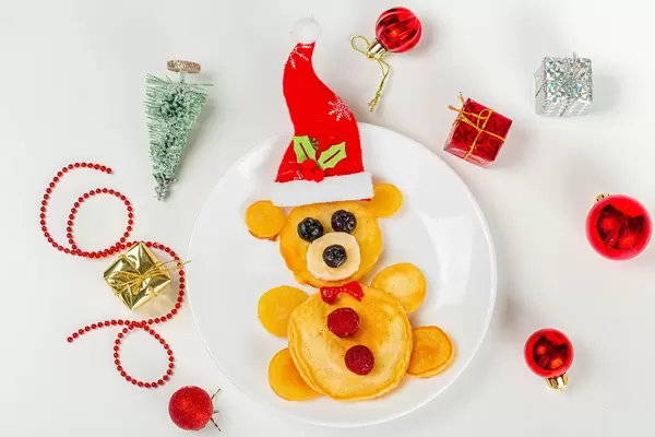 Bear pancakes with christmas decor, top view