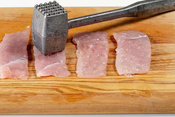 Beating chicken fillet with a kitchen hammer (Flip 2019)