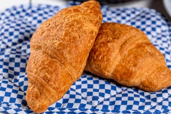 Beautiful and delicious croissants with fruit jam