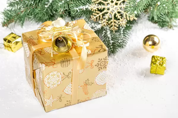 Beautiful christmas gift in gold packaging