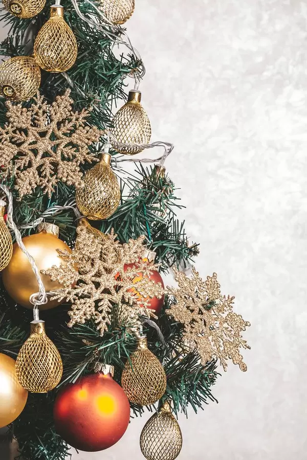 Beautiful decorated Christmas tree on a light background