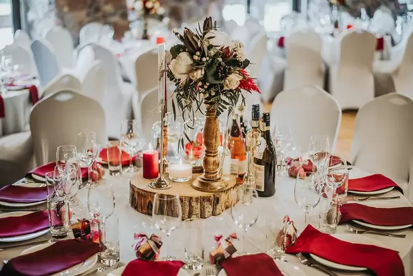 Beautiful decorated Table in a fancy Restaurant with Wine Glasses, Wine Bottles and Candles