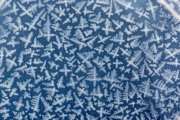 Beautiful frost structure on blue background