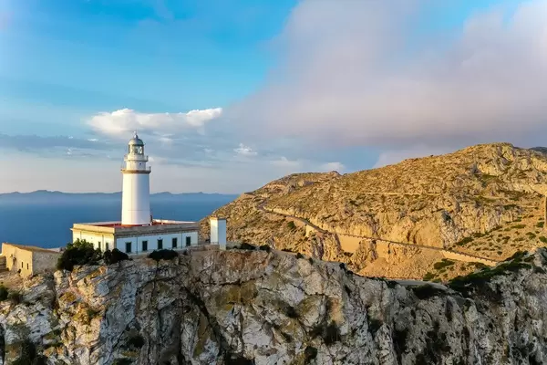 Beautiful light illuminates the lighthouse at Cap de Formentor (Mallorca) and the surrounding cliffs