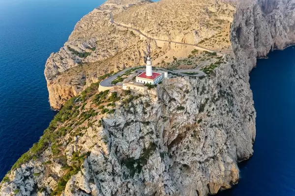 Beautiful Majorca: the rocky landscape of the Cap de Formentor headland with its lighthouse. Aerial view