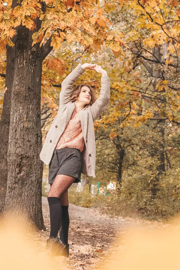 Beautiful model posing in autumn forest