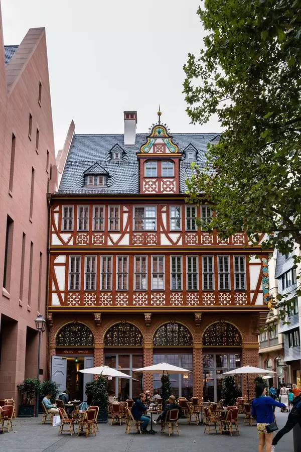 Beautiful old timber-framed house with a cafe near the Frankfurt Cathedral