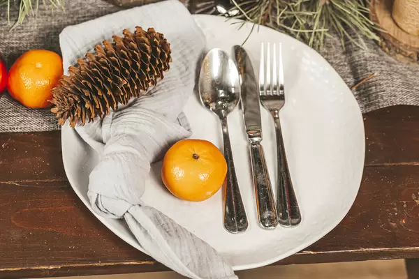 Beautiful table setting with christmas decorations, close up