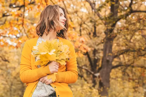 Beautiful young woman - colorful autumn portrait