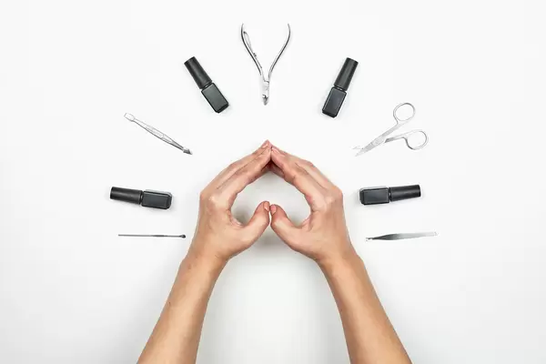 Beautifully manicured nails with tools for manicure