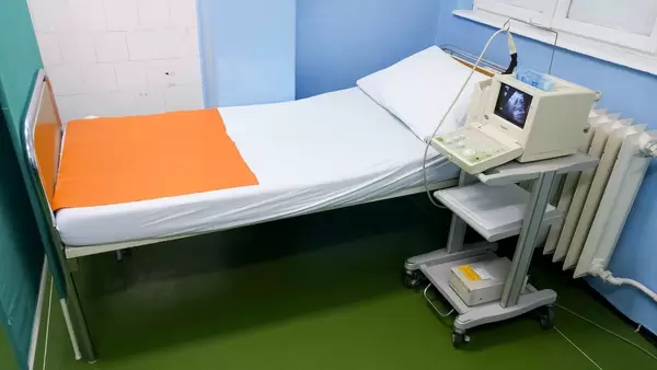 Bed and ultrasound device at a clinical department for gynecology and obstetrics  Flip 2019