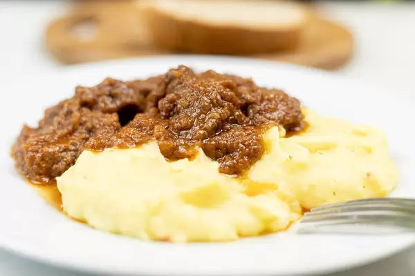 Beef Stew served with Mashed Potatoes on the plate