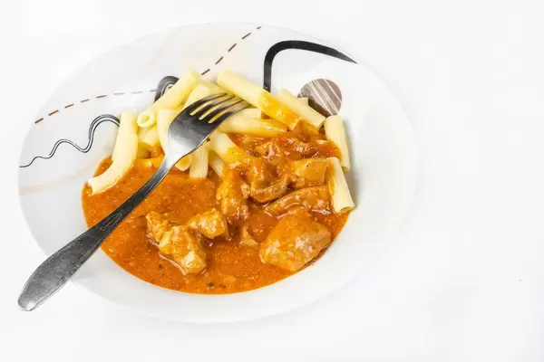 Beef Stew with Pasta above white background (Flip 2019)