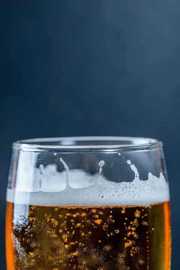 Beer in a glass on a dark background