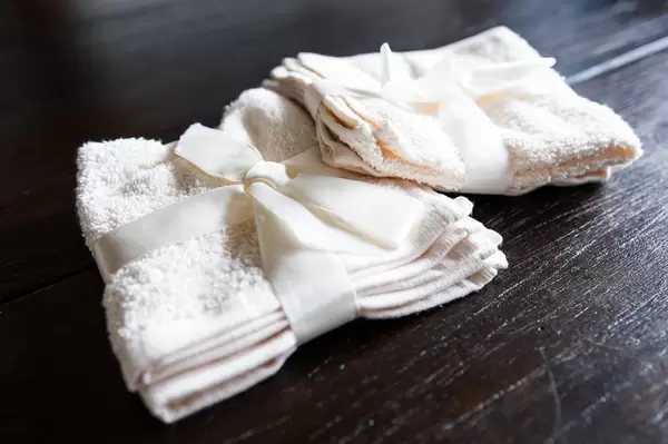 Beige towels on wooden table