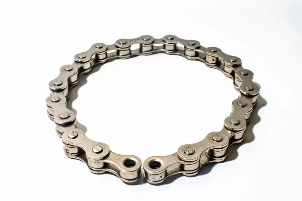 Bicycle chain on white surface