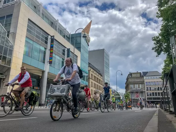 Bicycle demonstration Critical Mass focusses on environment and mobility while driving through the big city with music system as bicycle traffic