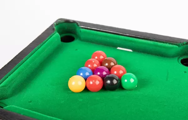 Billiard balls on green table