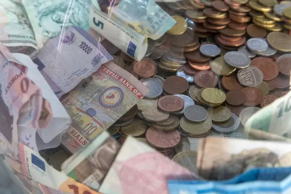 Bills and coins of different currencies