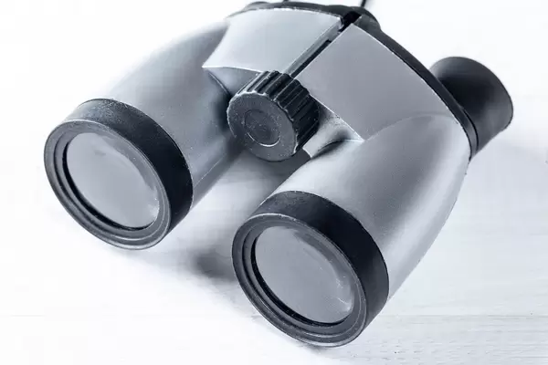 Binoculars a child's toy on a white background. Top view