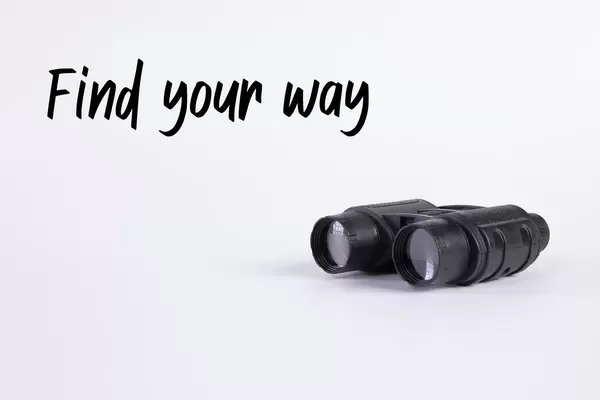 Binoculars with Find your way text on white background