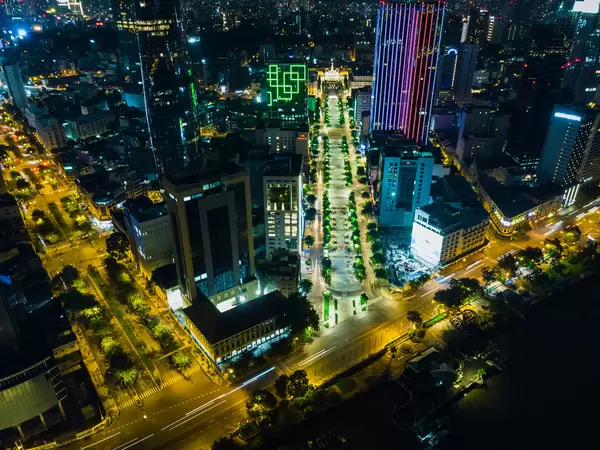 Bird View Night Photo of Nguyen Hue Walking Street with People's Comittee and Bitexco Financial Tower in the City Center of Ho Chi Minh City, Vietnam
