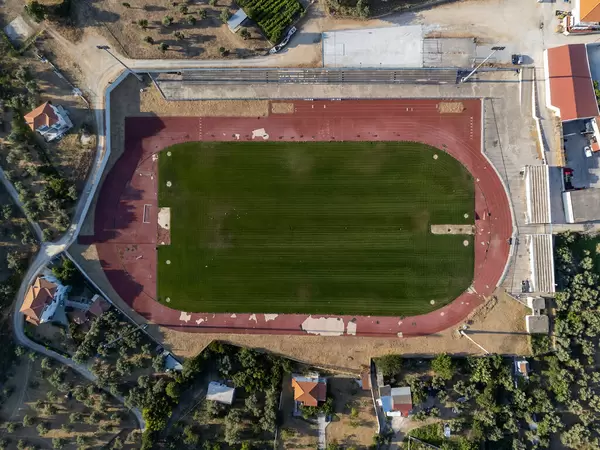 Bird's eye view of the stadium of Greek island Skopelos. Football field drone photography