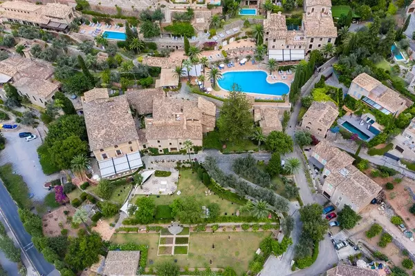 Bird's eye view: the stunning village of Deià on Mallorca with gardens and swimming pools