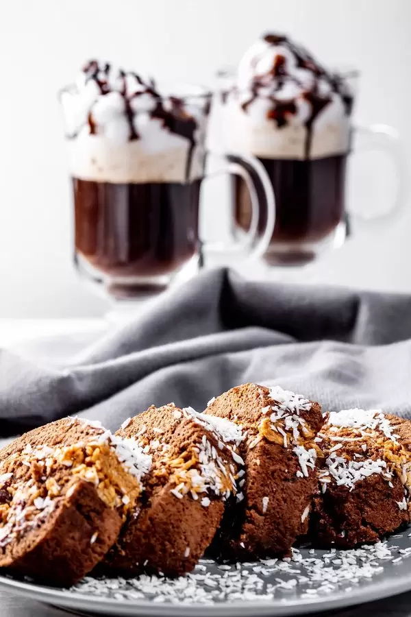 Biscuit roll with two cups of coffee