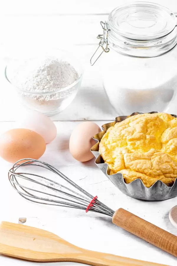 Biscuit with tools and ingredients for cooking