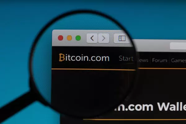 Bitcoin.com logo under magnifying glass