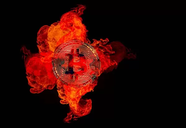 Bitcoin cryptocurrency burning in fire