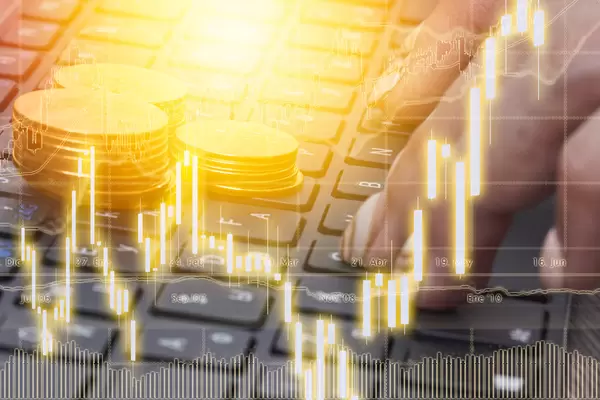 Bitcoin currency with blockchain concept on laptop keyboard with coins and charts and graphs