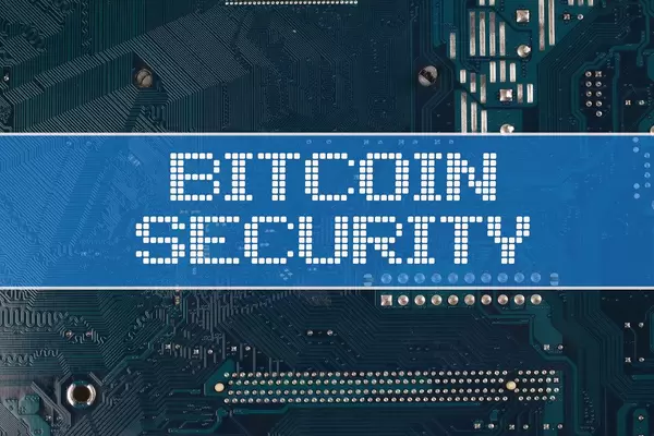 Bitcoin Security text over electronic circuit board background.jpg