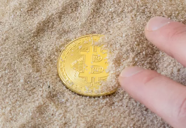 Bitcon in sand
