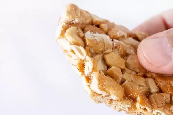 Bitten Cashew Bar in the hand (Flip 2019)