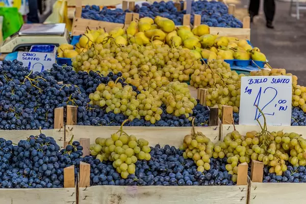 Black and white grapes on marketplace