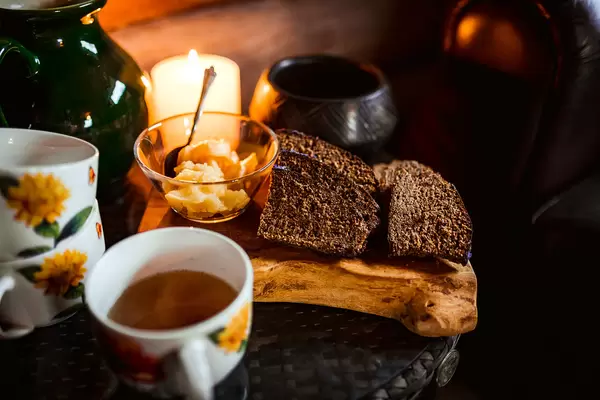 Black Bread Slices With Honey And Tea