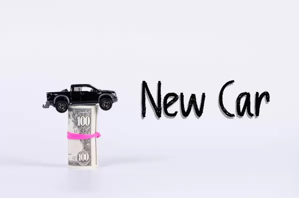 Black car with money roll and New car text on white background