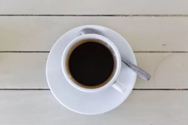Black coffee (americano) on wooden  background