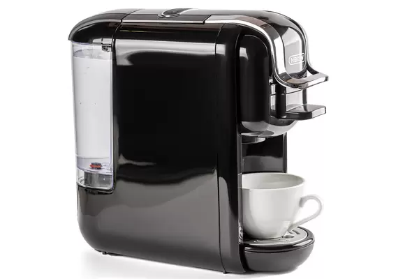 Black coffee machine with white cup