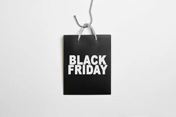 Black friday concept with bag shopping back on white