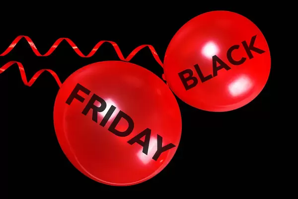 Black Friday inscription on red balloons, sale concept
