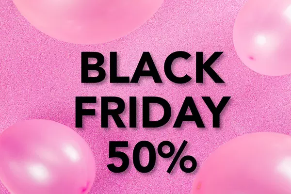 Black Friday sale concept on pink background with balloons