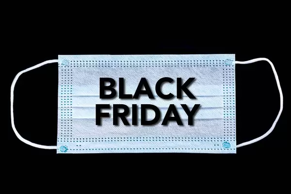 Black Friday text on protective face mask on black background