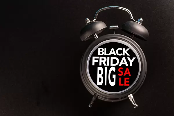 Black friday text with old analog clock. Black Friday sale concept