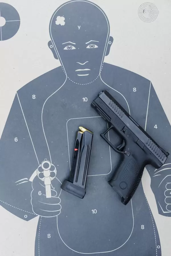 Black Gun And Ammo On the Target