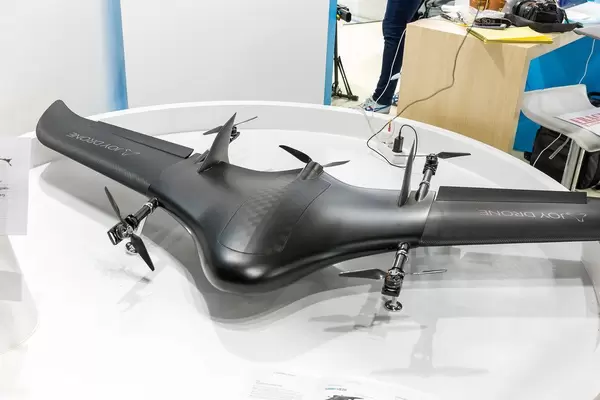 Black industrial Joy Drone with one-handed drone controllers