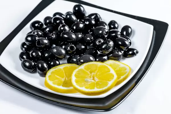 Black marinated olives with lemon slices  Flip 2019