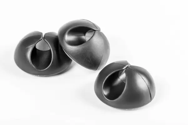 Black plastic clips for cables and wires on white